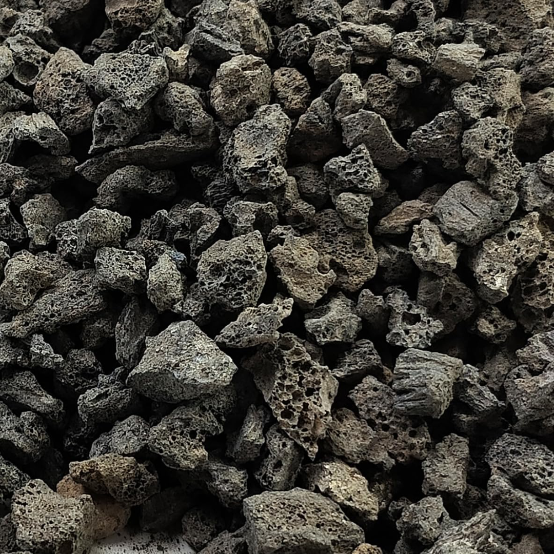 A close up look at small grain black lava rock.